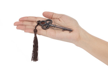 hand holding skeleton key isolated on white background