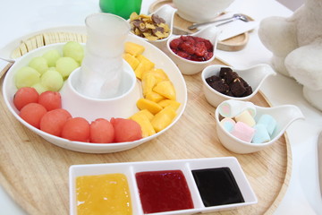 Shaved ice decorated with fresh fruit, Korean style Shaved Ice dessert , mix fruits banana,melon.