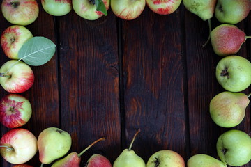 apples and pears on a dark background
