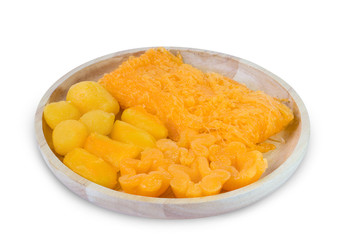 Close up Amazing traditional Thai desserts call Foi Thong, Thong yip and Thong Yod isolated on white background with clipping path. Thai sweet dessert made from eggs, coconut and bean cooked in syrup.