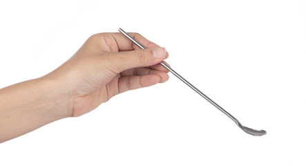 Hand holding Long handle metal spoon suitable for ice cream sundaes, cocktails  isolated on white background