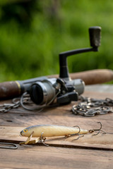  portrait of Fishing lure rod and reel in background © Don Mroczkowski