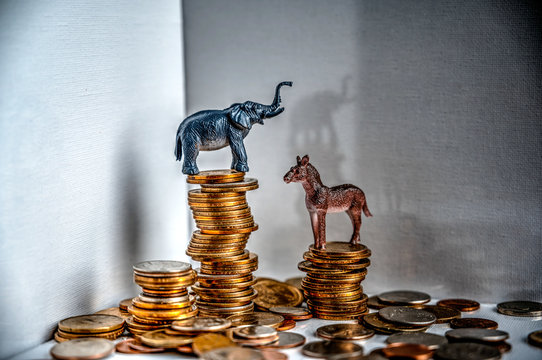 donkey and elephant on top of stacked coins