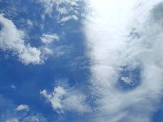 Beautiful nature of blue sky and clouds with the sun shining in the morning, sky background, cloudscape concept, Looking up