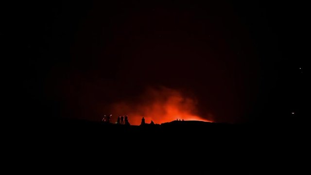 Ethiopia Erta ale crater volcano lake sunrise time lapse with people silhouette