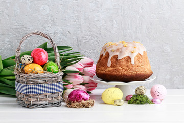 Basket of Easter eggs and traditional festive cake.