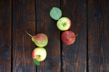 apples and pears on a dark background