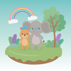 cute and little bear teddy and elephant in the field