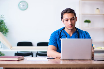 Young male doctor in telehealth concept