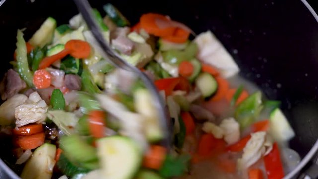 Cooking mixing filipino chopsuey vegetables