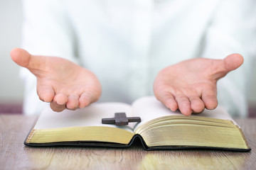 Hands praying on a Holy Bible, spirtuality and religion, Religious concepts