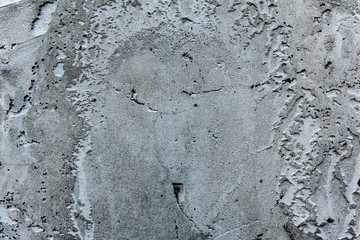 Texture of a concrete wall with cracks and scratches which can be used as a background