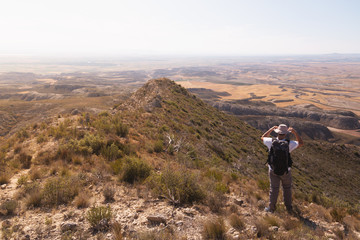 backpacker traveler with hat and white shirt