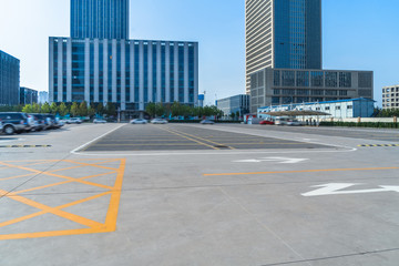 empty car park with downtown city space background