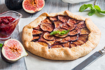 Homemade figs galette made with fresh organic figs on wooden table