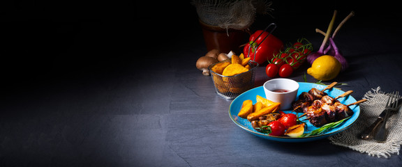 Obraz na płótnie Canvas cattle shashlik skewers with grilled vegetables on a caucasian