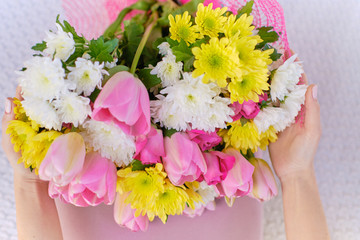 Ideally made manicure and pedicure. Women's legs and hands on the background of flowers