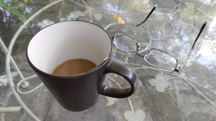 Obraz na płótnie Canvas cup of coffee and glasses