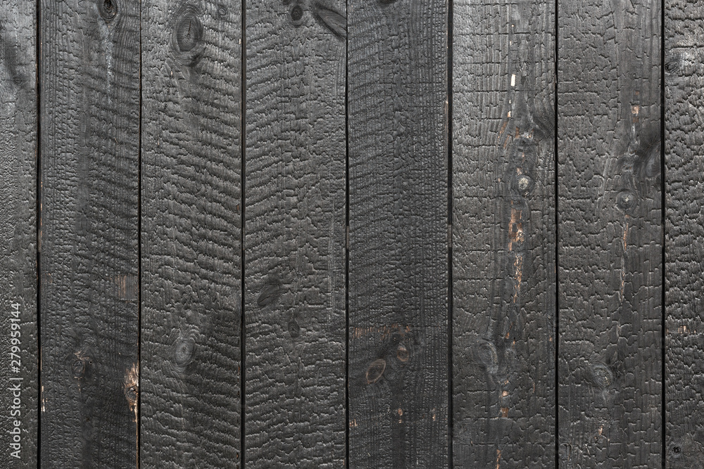 Wall mural burnt wooden board texture. sho-sugi-ban yakisugi is a traditional japanese method of wood preservat