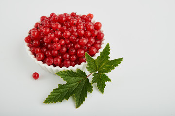 Redcurrant pile (Ribes Rubrum) with leaves. Clipping paths, shadow separated, infinite depth of filed