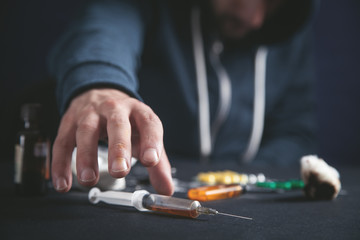 Man with a syringe. Addiction, death
