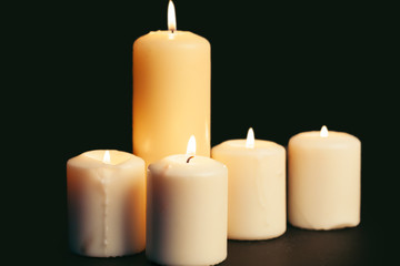 Fototapeta na wymiar Candle flame close up on a black background