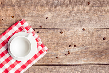 mug on wooden table over grunge background