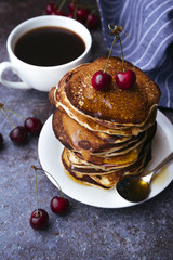Delicious american pancakes with cherry on top