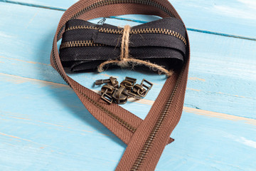 Black and brown metal brass zippers stripes with sliders for handmade leatherwork leathercraft on...