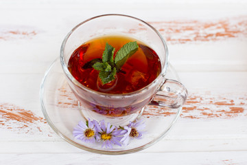 Hot healing black tea with raspberries. Medicinal broth.