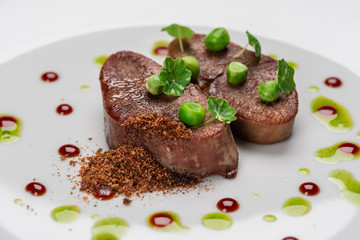 fried beef tongue with young peas, basil sauce and grated walnut