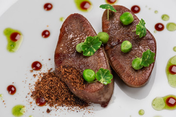fried beef tongue with young peas, basil sauce and grated walnut