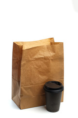 Paper bag on white background with coffee cup  Mockup for design .