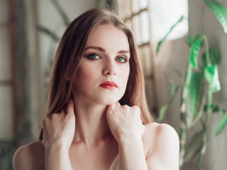 Portrait of beautiful balerina woman weared in white dress. Studio shot, natural light  © Olena Tkachenko