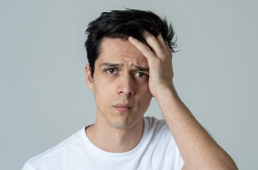 Portrait of sad and depressed man. Isolated on neutral background. Human expressions and emotions