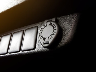 12 Volt power outlet socket and cigarette lighter in the car.