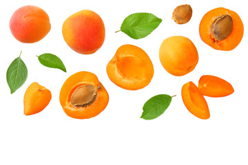 apricot fruits with slices and green leaf isolated on white background. top view