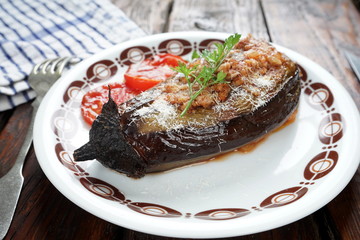 baked stuffed eggplant with tomatoes and Parmesan cheese