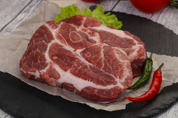 Raw pork neck steak