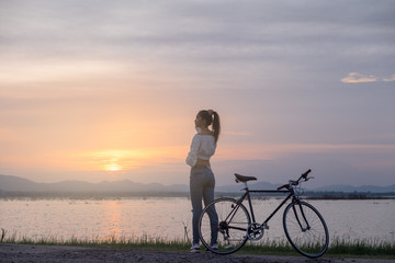 Cyclist on background of sunset, sport and travel concept