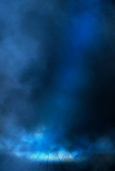 Empty street scene background with abstract spotlights light. Night view of street light reflected on water. Rays through the fog. Smoke, fog, wet asphalt with reflection of lights. 