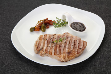 Grilled pork steak with pepper sauce