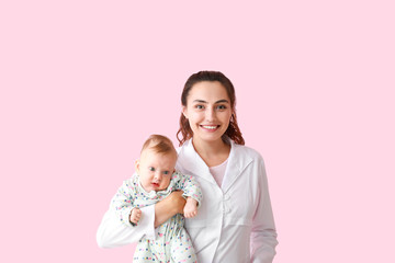 Pediatrician with cute little baby on color background