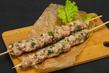 Raw minced pork skewer kebab for grill