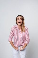 Laughing woman in striped shirt, portrait