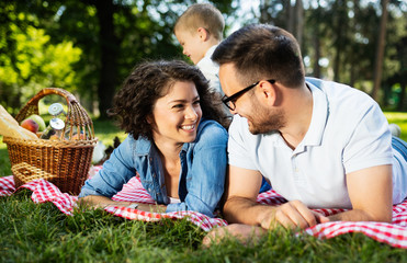 Family picnic outdoors togetherness relaxation happiness concept