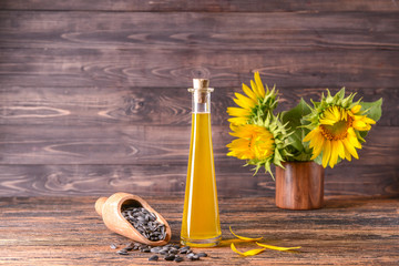 Composition with sunflower oil on table