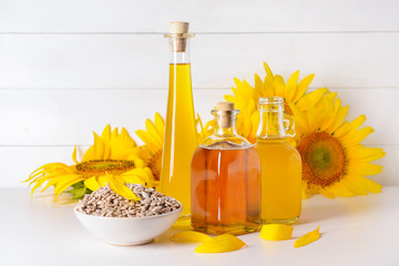 Composition with sunflower oil and seeds on table