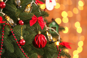 Fototapeta na wymiar Beautiful Christmas tree against defocused lights, closeup