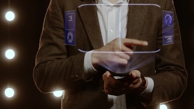 Businessman activates conceptual HUD hologram on smartphone with text Bonus. Man in a white shirt and jacket with a holographic screen on the background of lights
